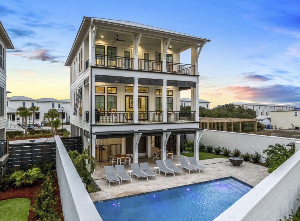 Custom home and gunite pool built together by DD&B Custom Home & Pool Builders in Gulf Shores AL — elevated coastal design with outdoor living area