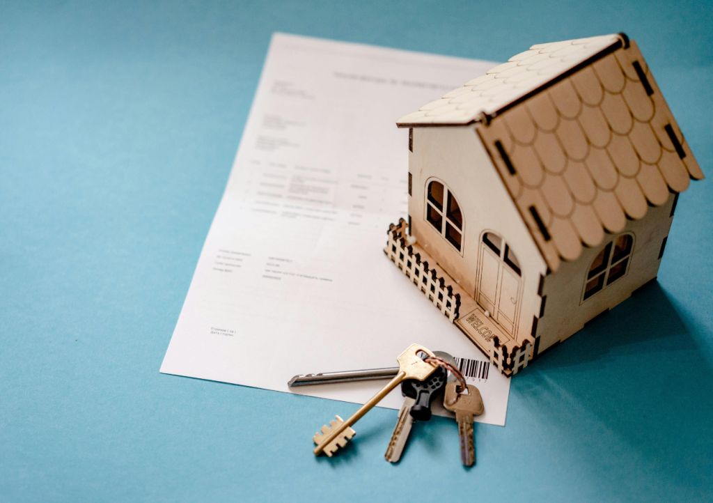 Model home with keys on a building contract — how to get a quote for a custom home or pool build in Gulf Shores AL